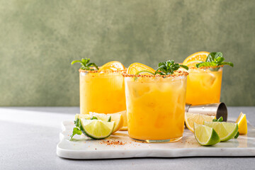 Fototapeta Triple citrus margarita with orange, lemon and lime obraz