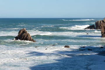 Asturian coast, covered in rocks and tourist waters