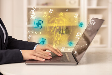 Doctor working on laptop with healthcare concept