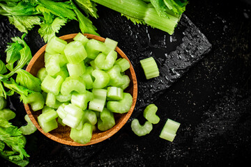 Pieces of fresh celery in a wooden plate. 