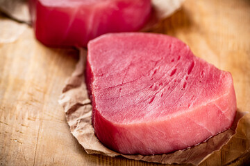 Fresh raw tuna steak on the table. 