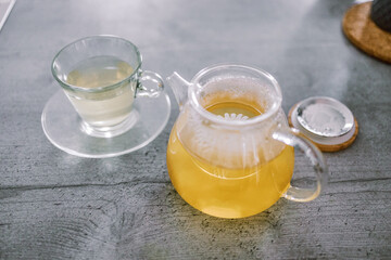 Cup of tea with chamomile flowers 