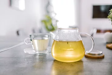 Fototapeten Herbal tea in a glass teapot © Maria Ch.