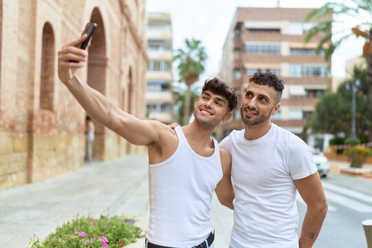 Two hispanic men couple smiling confident make selfie by smartphone at street