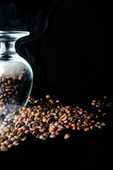 Freshly roasted coffee beans on a black background