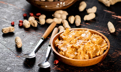 A plate of peanut butter on the table. 