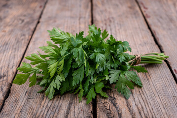 Parsley on wooden background