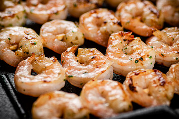 Delicious grilled shrimp. Macro background.