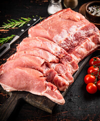 Sliced pork raw on a cutting board. 