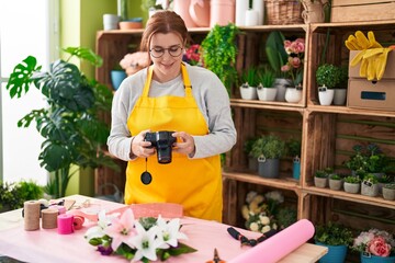 Young beautiful plus size woman florist make photo to bouquet of flowers gift at flower shop