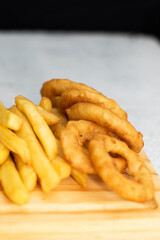 Burger cheese with potato in wooden table and black backgournd 