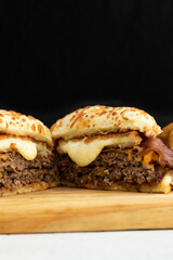 Burger cheese with potato in wooden table and black backgournd 