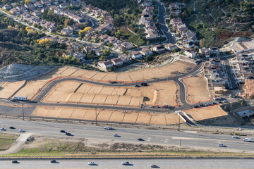 Aerial of view of graded dirt lots ready for new tract home construction in Los Angeles County California. - obrazy, fototapety, plakaty