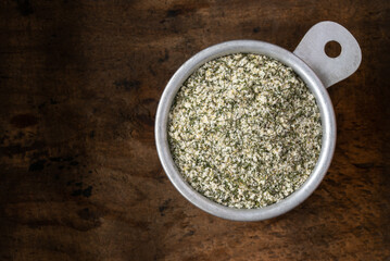 Dill Pickle Seasoning in a Measuring Cup