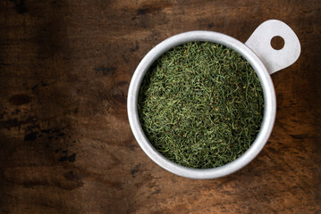 Dill Weed in a Measuring Cup