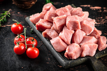 Chopped raw pork with fresh tomatoes and rosemary. 