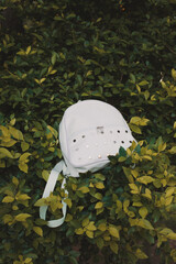 White backpack with metal details