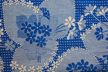 A fragment of the texture of a white-blue tablecloth made in the 1960s in Ukraine. Traditional national ornament.