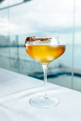 cocoa liqueur, cocoa cocktail with rum against the background of the sea