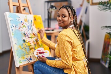African american woman artist smiling confident drawing at art studio