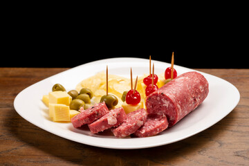 Picada with a variety of cheeses, meat and cherries