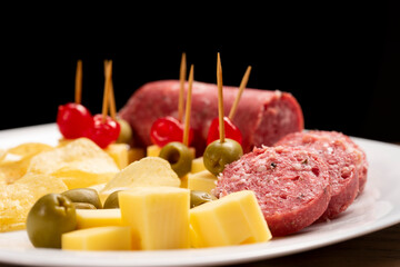 Picada with a variety of cheeses, meat and cherries