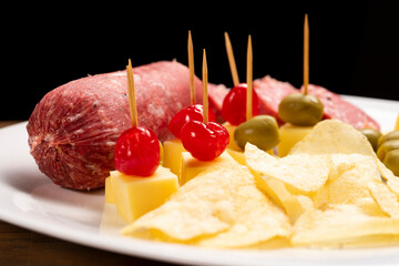 Picada with a variety of cheeses, meat and cherries