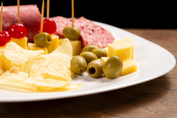 Picada with a variety of cheeses, meat and cherries