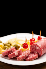 Picada with a variety of cheeses, meat and cherries