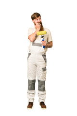 Adult painter man full body cut out isolated relaxed thinking about something looking at a copy space.