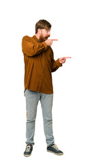 Naklejka premium Adult redhead man full body isolated