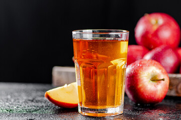 Fresh homemade apple juice. On a black background.