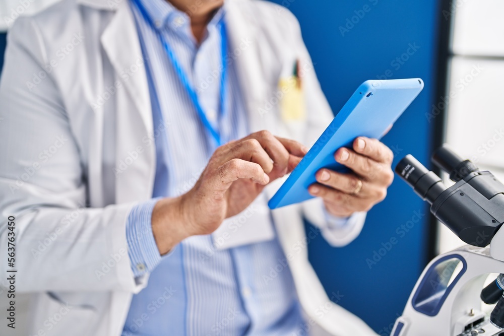 Canvas Prints Senior man scientist using touchpad working at laboratory