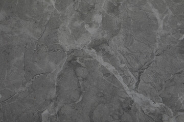 Texture of dark grey marble surface as background, closeup