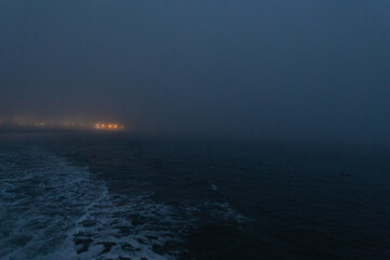 Foggy calm sea in the late evening