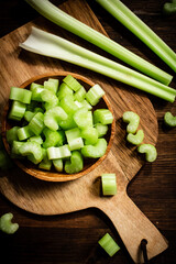 Sliced fresh celery on a cutting board. 