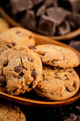 Homemade cookies with chocolate. Against a dark background