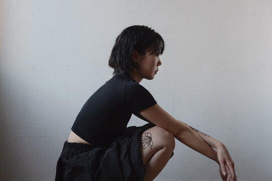 Portrait of asian young woman  with henna tattoo on legs