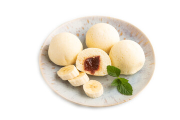 Japanese rice sweet buns mochi filled with jam isolated on white. side view.