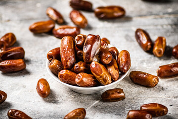Full bowl with dates on the table. 