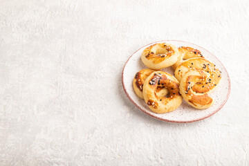 Homemade asian salted cookies on gray concrete, side view, copy space.