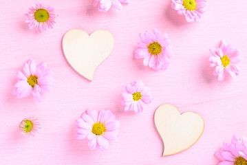 Chrysanthemum flower with heart shape on pink background, Love Valentine concept