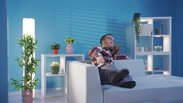 Depressed young man with dwarfism crying at home helpless and sad.
Unhappy and lonely disabled dwarf young man at home depressed and crying.
