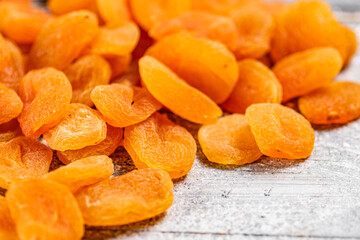 A pile of delicious dried apricots on the table. 