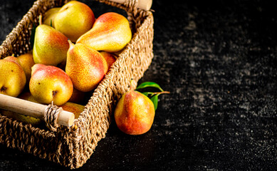 Fresh pears in a basket. 
