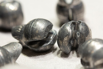 A close-up, macro image of lead fishing sinkers