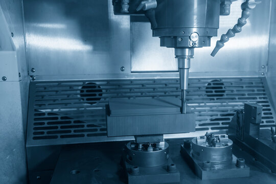 The CNC milling machine rough cutting the graphite electrode parts with solid ball end mill.