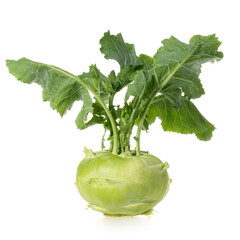 Fresh kohlrabi with green leaves on isolated white backround