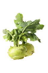 Fresh kohlrabi with green leaves on isolated white backround