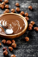 Hazelnut butter in a plate with a spoon. 